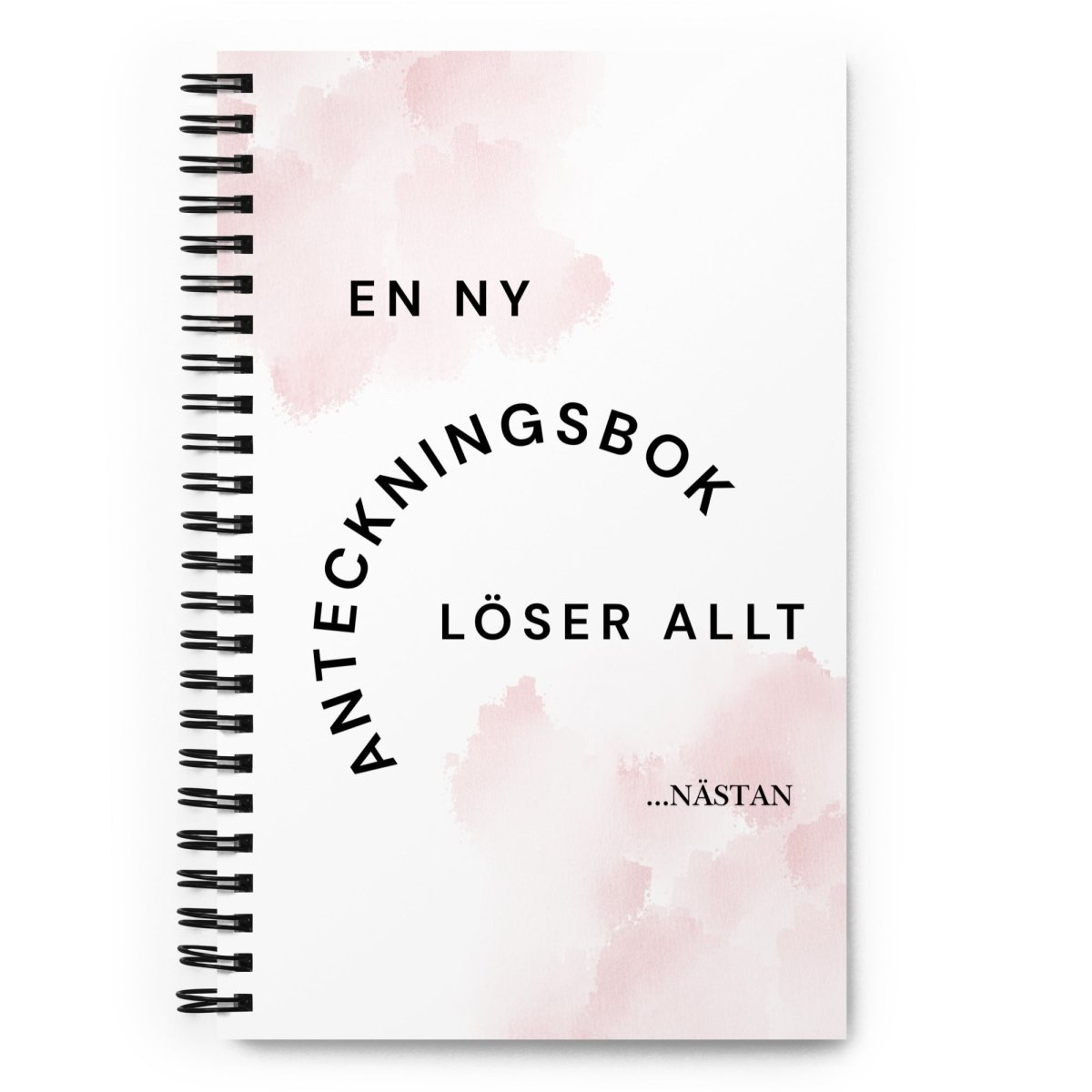 Notebook med texten "En ny anteckningsbok löser allt" – spiralbunden med prickade sidor.